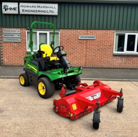 John Deere 1570 TerrainCut Rotary Mower with a Trimax Flaildek FX155 Out Front Flail